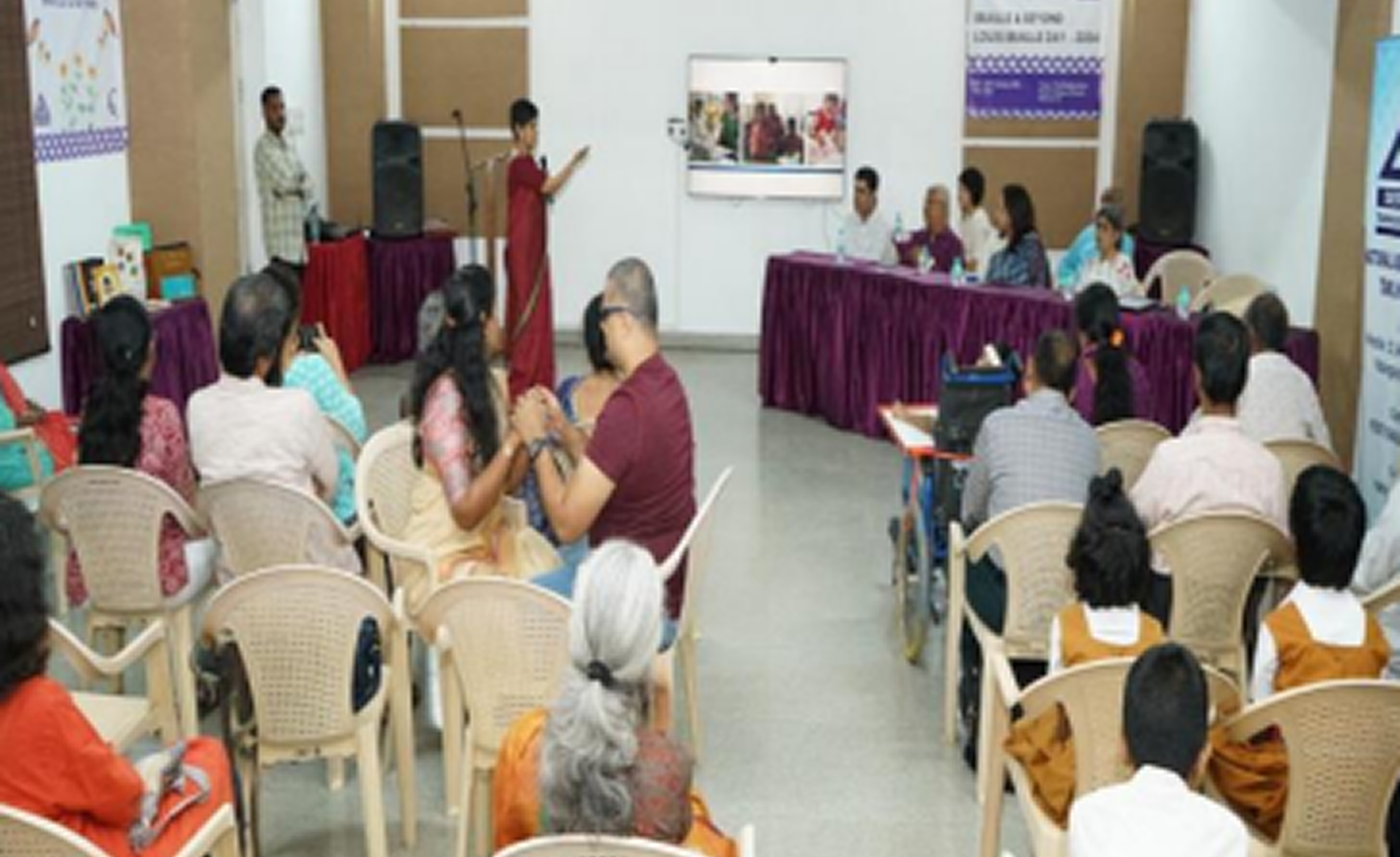 Group of blind students performing with drums in front of an audience
