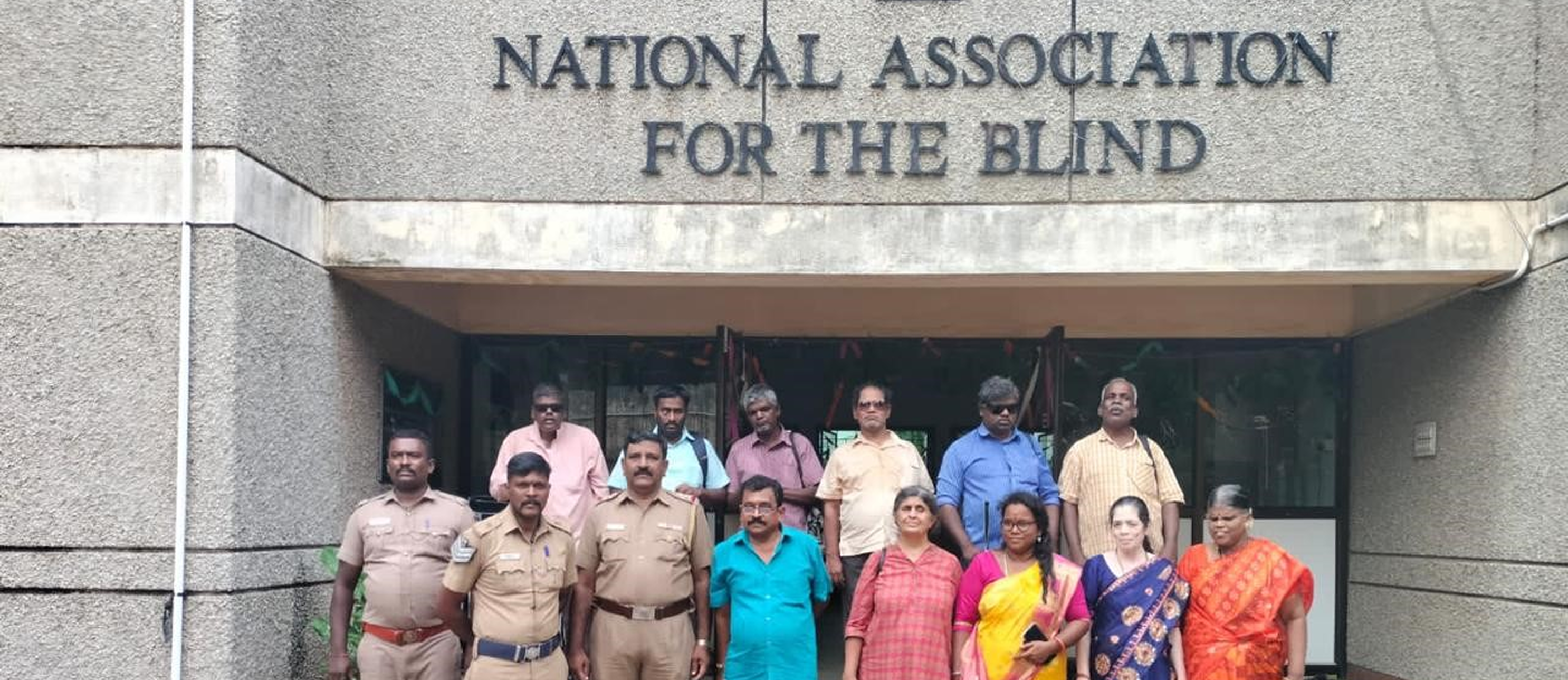 Blind student in uniform playing drum with passion
